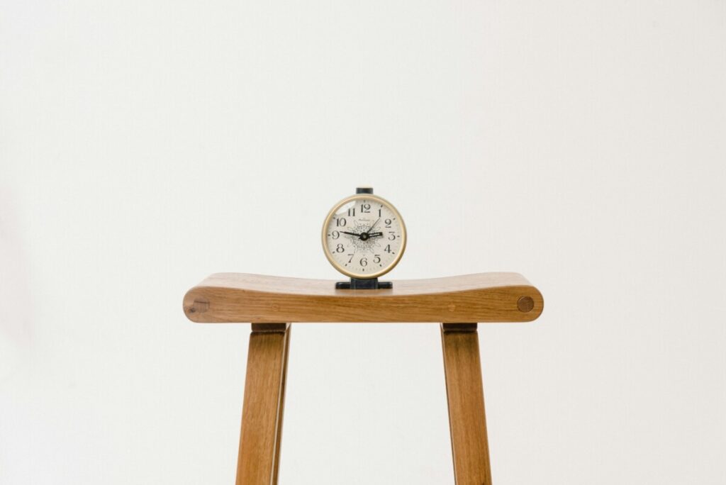 brown wooden table clock at 10 10