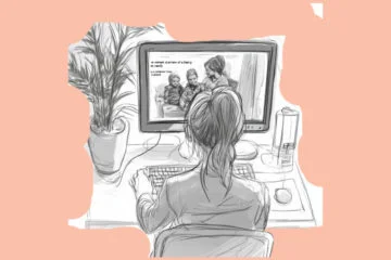 A girl looking at a picture of a family on a computer screen (PixlR Review: A Tool for Stunning Visuals?)