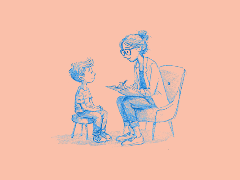A therapist in a counseling session with a child.