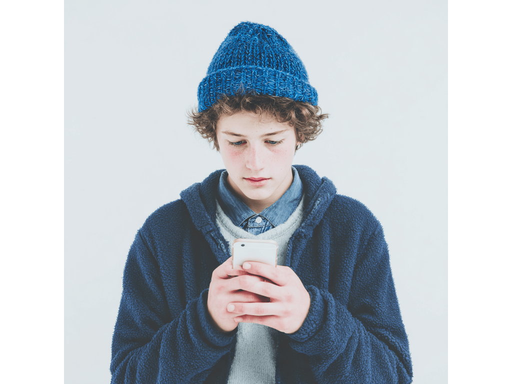 A teenager using ChatGPT on their phone